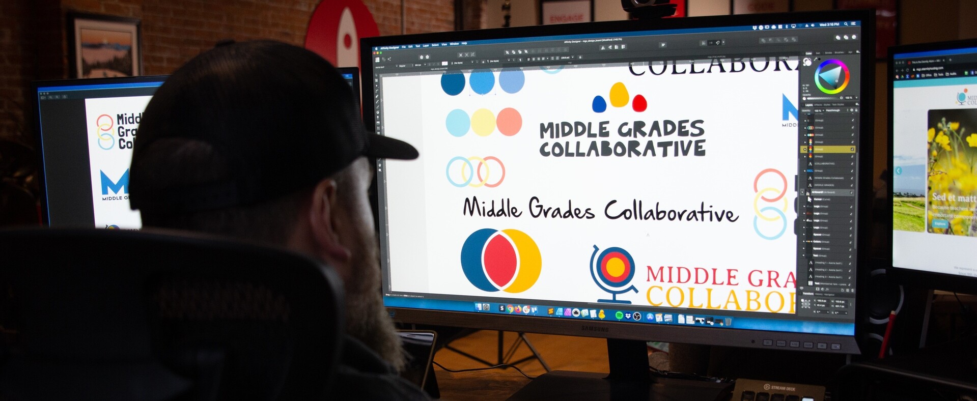 Person designing logos for "Middle Grades Collaborative" on computer screens.