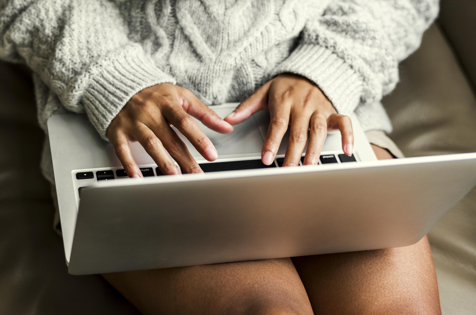 closeup of woman working on laptop