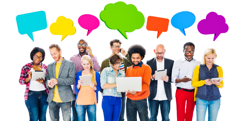 Group of people holding electronic devices, with vibrant colored thought bubbles above their heads indicating digital communication and ideas.