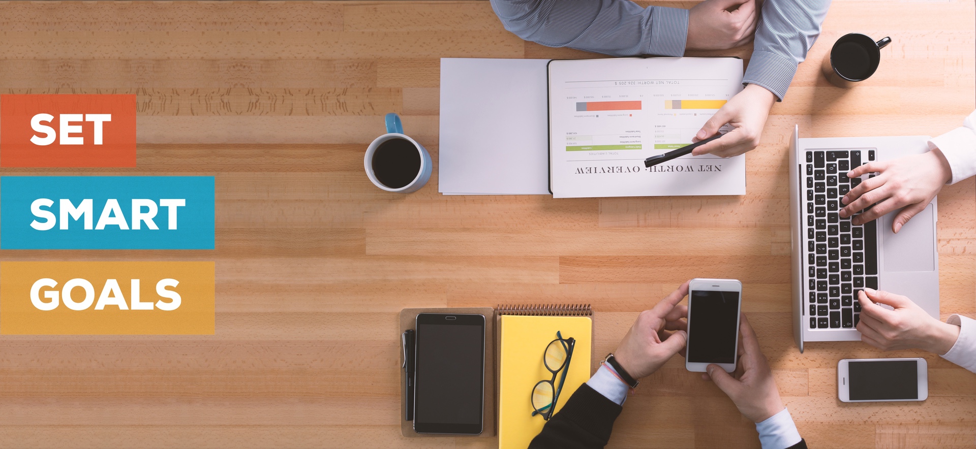 set smart goals people working around a table